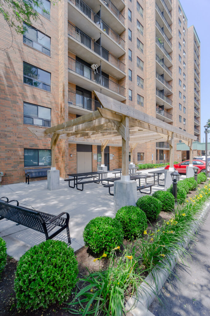 Outdoor resident pergola and gathering space with new site furnishings