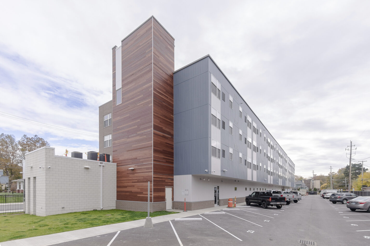 Long elevation showing rear facade and resident parking