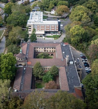 Aerial drone view of the Hitchcock Center for Women site showing the new addition alongside the historic brick treatment center