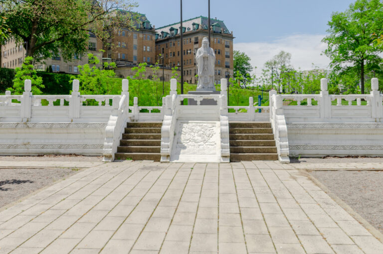 Confucius statue and stone bridge on the grounds adjacent to Park Lane Villa